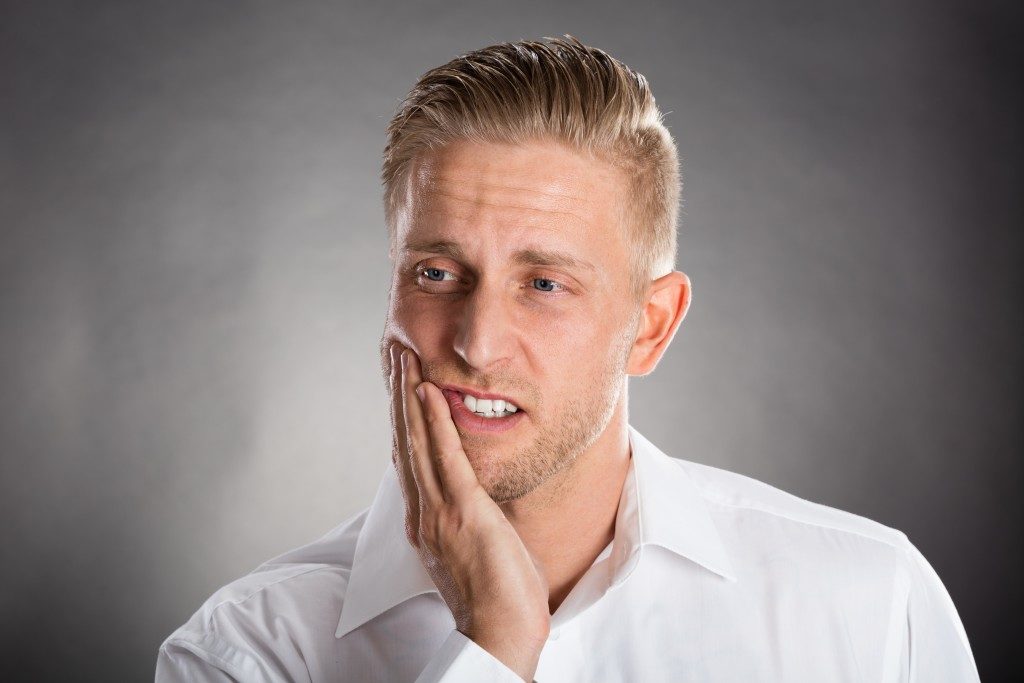 Man experiencing toothache