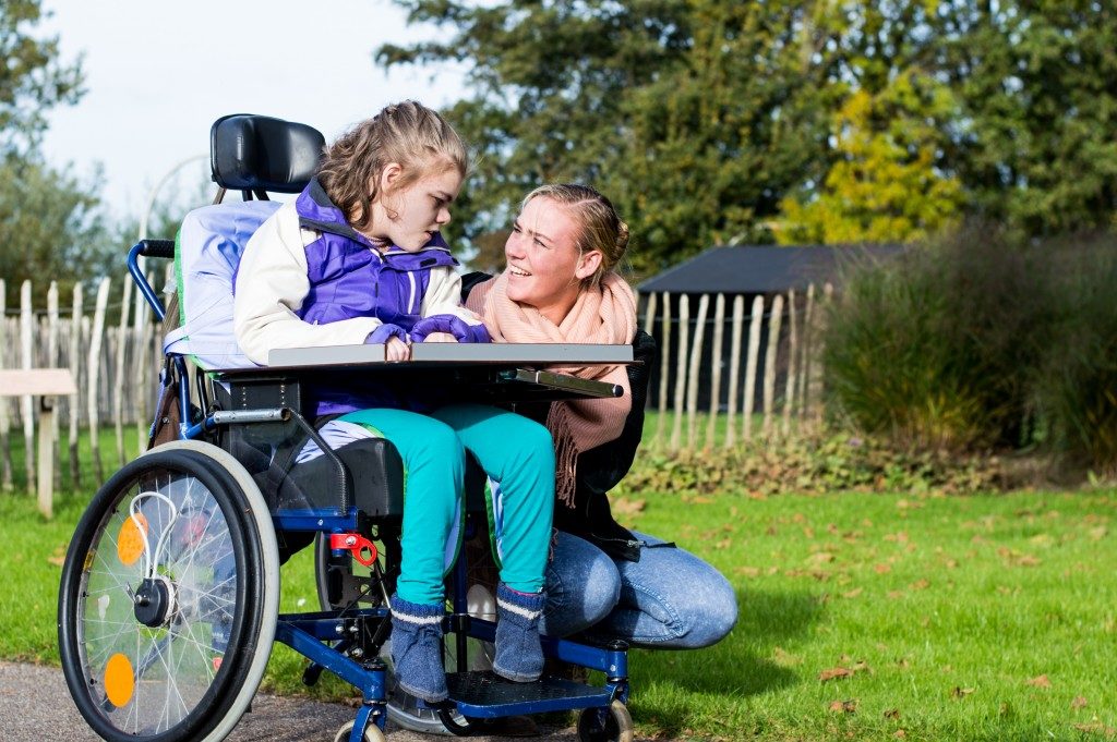 disabled person talking to a girl