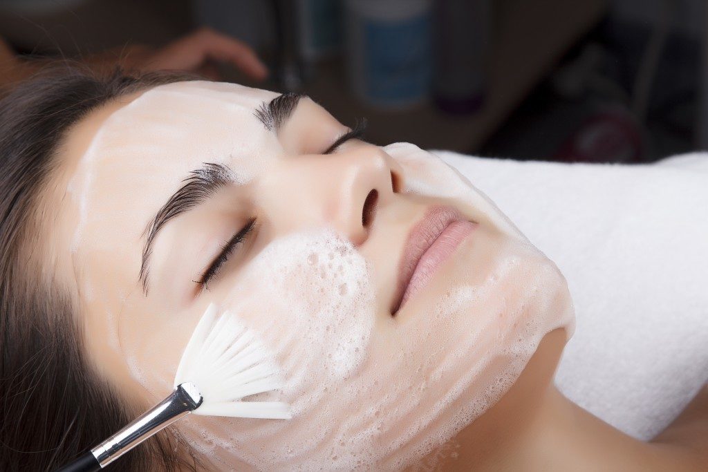 Woman having a facial cleanse