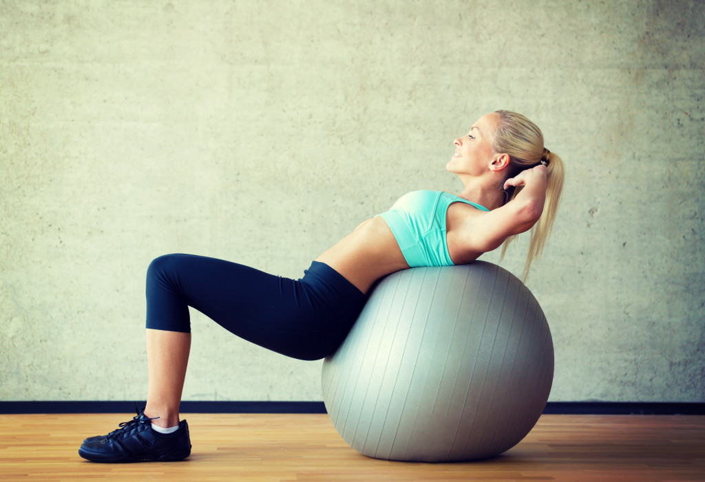 A fit woman using an exercise ball