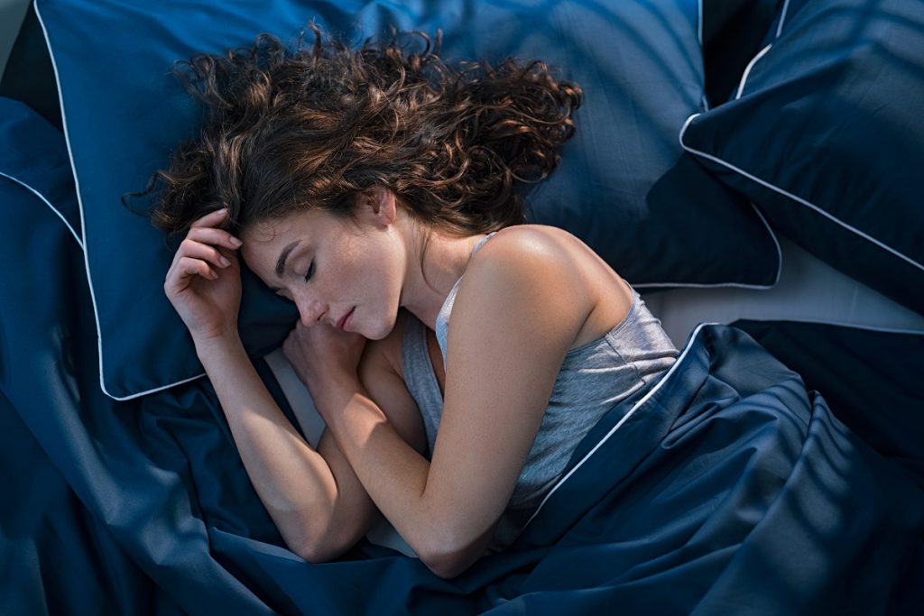 young woman sleeping at night